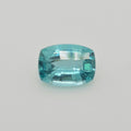A single cushion-cut light blue gemstone with a faceted, polished finish, centered on a plain light gray background.