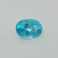 A faceted oval-cut light blue gemstone centered on a light gray background