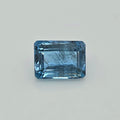 A rectangular blue gemstone with a beveled edge, shown on a plain light gray background.