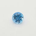 A single round-cut blue gem centered on a plain white background.