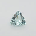 A single triangular faceted gemstone with a light blue-green hue, photographed on a clean light gray background.