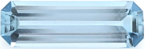 A rectangular, faceted light blue gemstone shown on a plain white background.