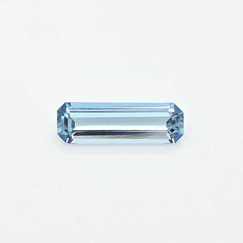 A light blue rectangular emerald-cut gemstone centered on a clean white background.