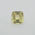 A single square emerald-cut yellow gemstone with faceted edges, centered on a light gray background.