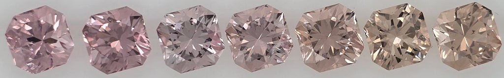 Seven loose square-cut pink to pinkish orange gemstones displayed side-by-side on a plain white background.