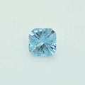 A single light blue square-cut gemstone, centered on a clean, pale off-white background.
