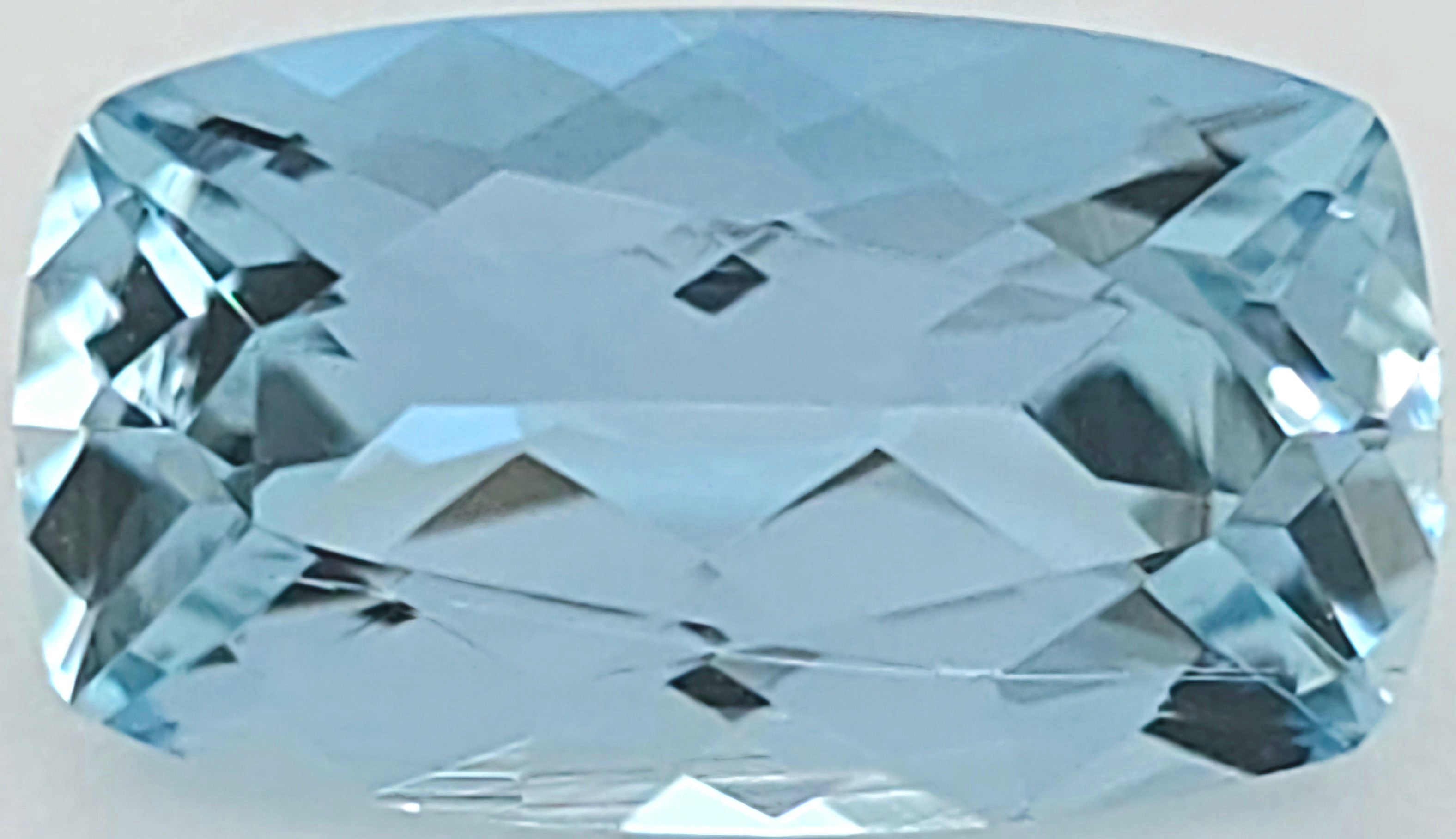 A light blue cushion-cut faceted gemstone, shown on a plain white background.