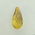 A faceted teardrop-shaped crystal briolette in a transparent greenish-yellow color, shown on a plain light gray background.