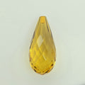 A faceted teardrop-shaped translucent greenish yellow briolette, shown on a plain light gray background.